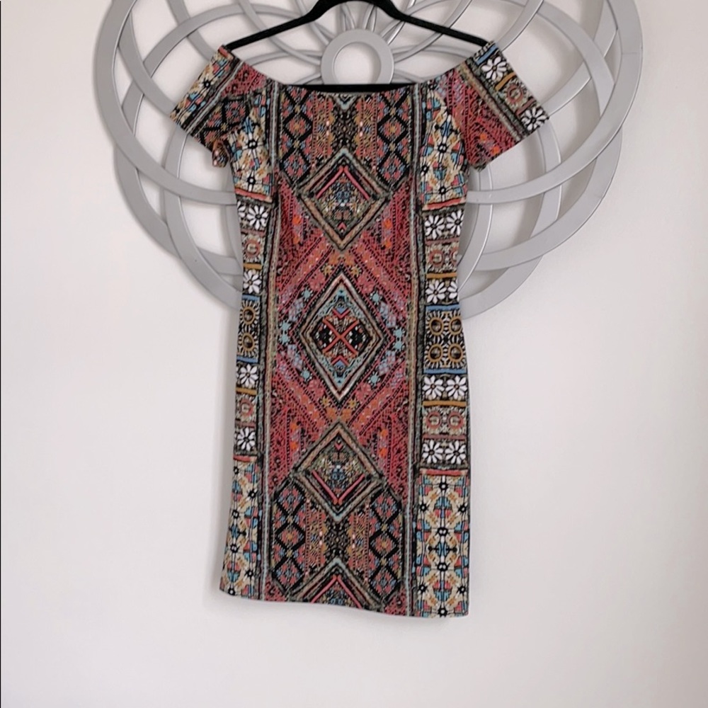 Multicolored off shoulder dress.